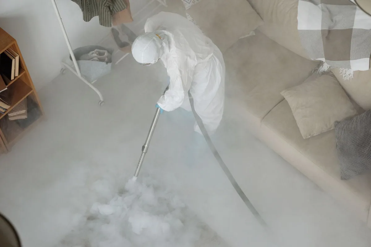 Biohazard cleanup technician in protective equipment, Beverly, MA